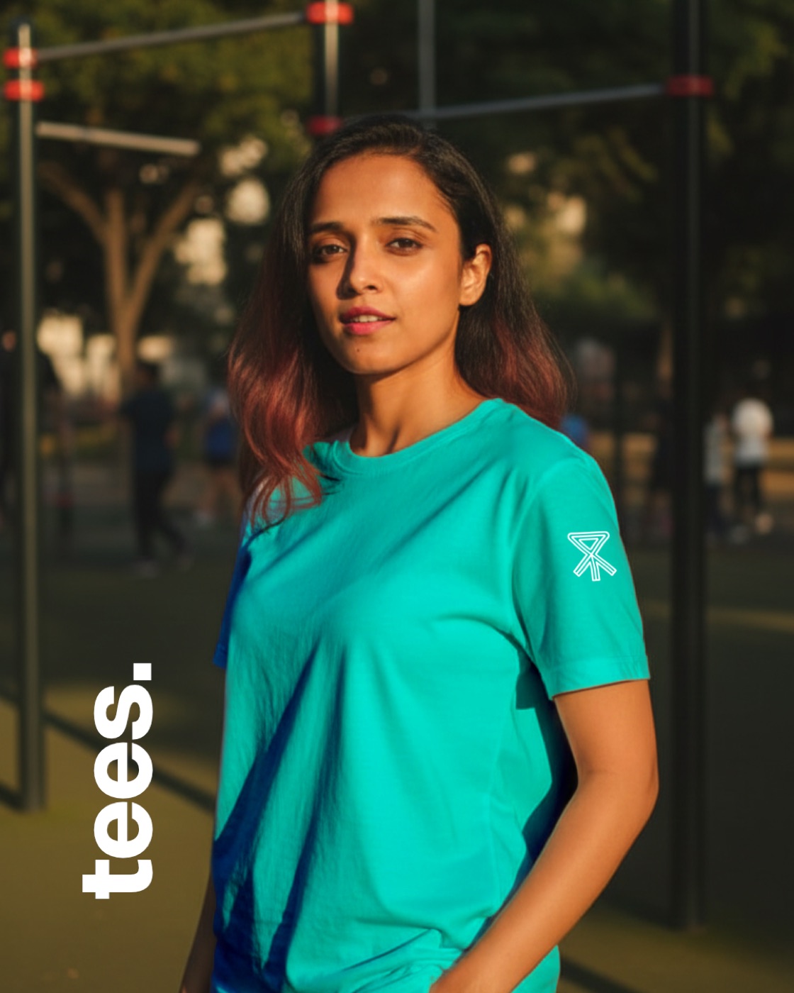 Club member in a teal Pacework Crew tee at an outdoor gym