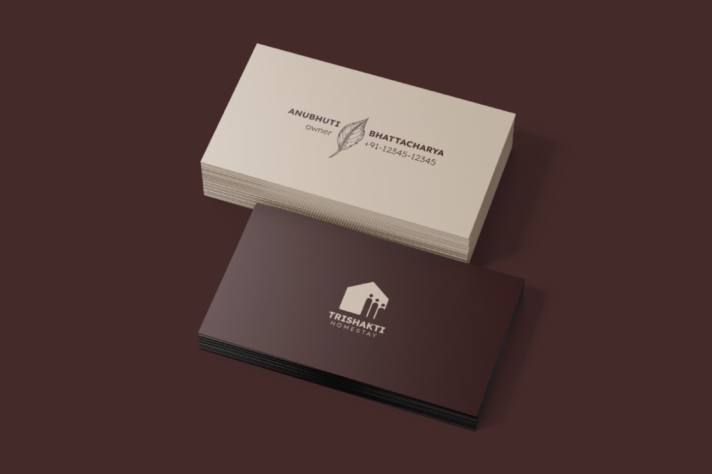 Trishakti Homestay business cards in cream and maroon